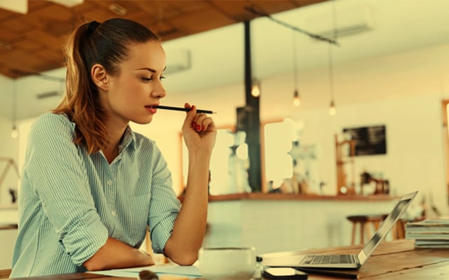 Young woman studying for her theory test