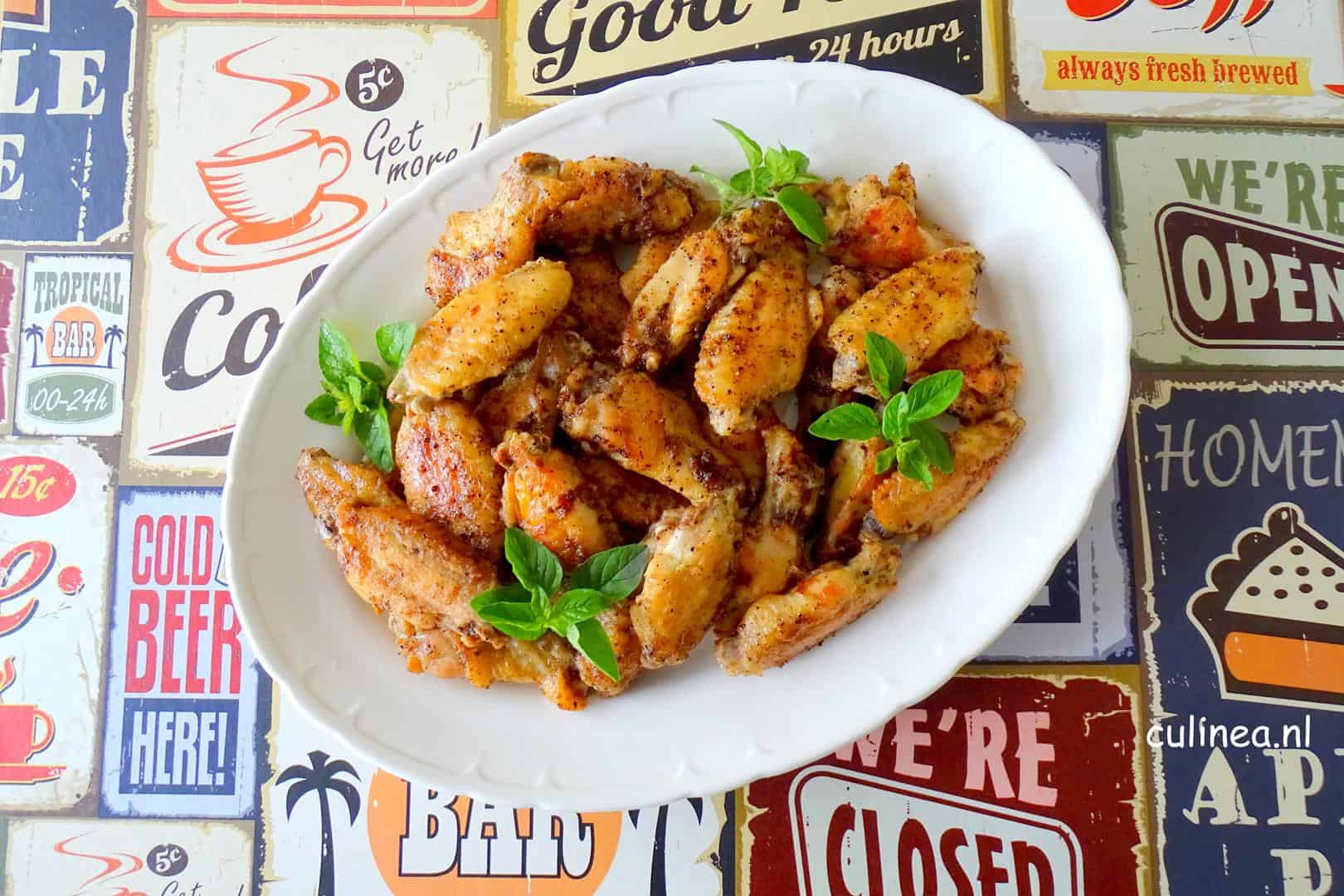 Kipvleugels met citroen en peper