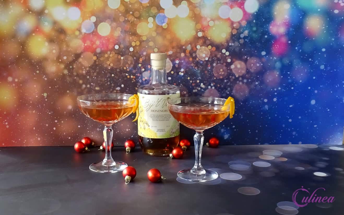 Cocktail met honingrum en granaatappel